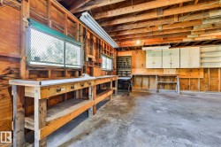 Spacious utility area featuring exposed wood framing and ceiling joists - 