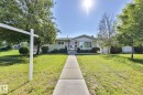 Ranch-style exterior with stucco and stone accents - 12919 86 Street, Edmonton, AB 