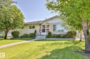 Exterior stucco siding with brick-style detailing - 12919 86 Street, Edmonton, AB 