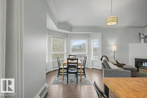 401 10827 85 Avenue, Edmonton, AB - Indoor Photo Showing Other Room With Fireplace