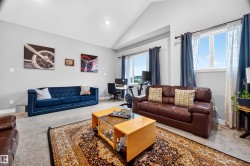 Vaulted ceilings with recessed lighting define this spacious interior - 