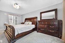Grey carpeting complements light grey walls - 