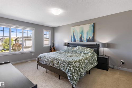 Bright room featuring light grey walls and neutral carpet - 1651 Hammond Crescent, Edmonton, AB 