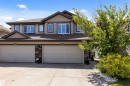 Two-story residence featuring a combination of horizontal siding and shingle accents - 1651 Hammond Crescent, Edmonton, AB 