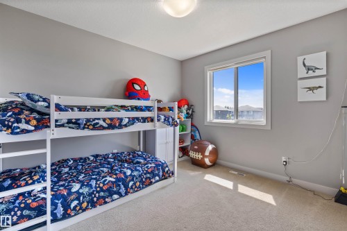 Neutral tone walls with light-colored carpet flooring - 1651 Hammond Crescent, Edmonton, AB 