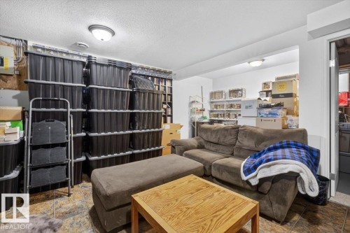 Lower level room featuring tiled flooring and recessed lighting - 27 Walden Park, St. Albert, AB 