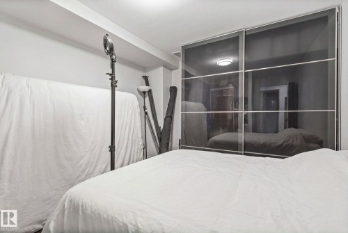 Sliding mirrored closet doors with chrome framing - 201 10388 105 Street, Edmonton, AB 