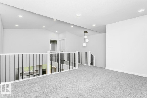 Bonus room. Virtually staged for illustration purposes. Furniture and decor not included. - 2940 65 Street, Edmonton, AB 