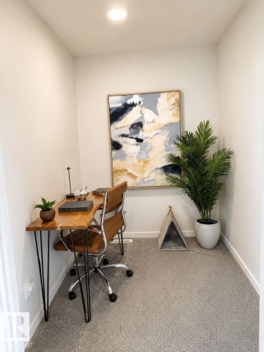 Compact room featuring light-toned walls and plush carpeting - 311 32 Street, Edmonton, AB 