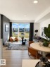 Open concept living area with light wood-finish flooring - 311 32 Street, Edmonton, AB 