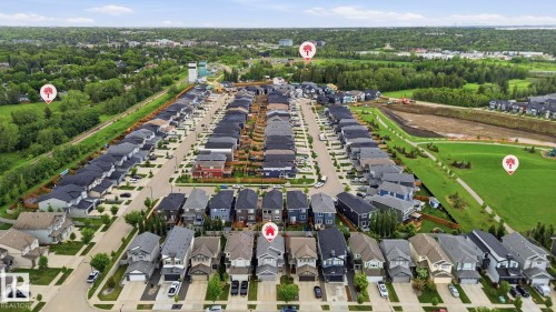 Aerial view showcasing a residential development with varied architectural styles - 33 Riviere Terrace, St. Albert, AB 