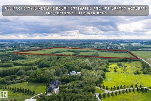 Expansive rural land parcel featuring a mix of open fields and mature tree cover - 23327 Twp Rd 510, Rural Leduc County, AB 