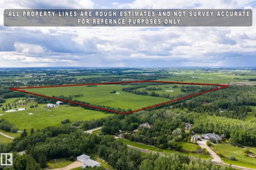 Expansive green acreage featuring a defined property line - 23327 Twp Rd 510, Rural Leduc County, AB 