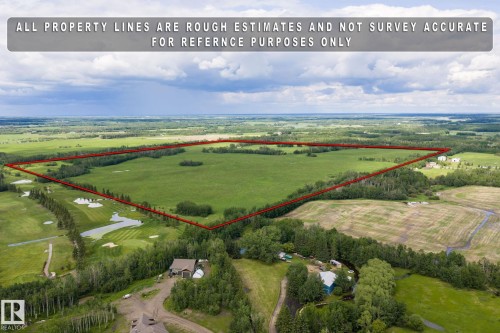 Expansive parcel of land bordered by mature trees and open fields - 23327 Twp Rd 510, Rural Leduc County, AB 