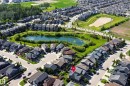 Aerial perspective showcasing a residential neighborhood with varied architectural styles - 5430 Edworthy Way, Edmonton, AB 