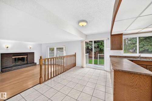 Tiled flooring extending to a sliding glass door for outdoor access - 9843 188 Street, Edmonton, AB 