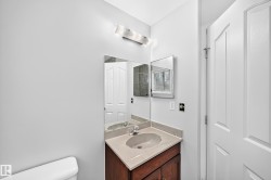 Vanity with a light-toned countertop and an integrated sink basin - 
