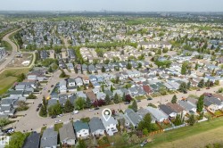 Aerial overview of a residential neighborhood with varied housing styles - 