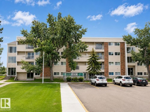Multi-story residential building featuring a brick and stucco facade - 38 11265 31 Avenue, Edmonton, AB 