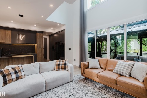 Open concept living area with high ceilings and expansive windows - 1313 Clement Crest, Edmonton, AB 
