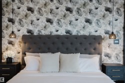 Accent wall featuring a gray floral pattern - 