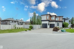Contemporary architectural design featuring a multi-tone facade with wood-look and light-toned siding - 