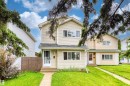 Two-story property featuring light-colored siding and a dark shingle roof - 359 Kirkpatrick Crescent, Edmonton, AB 