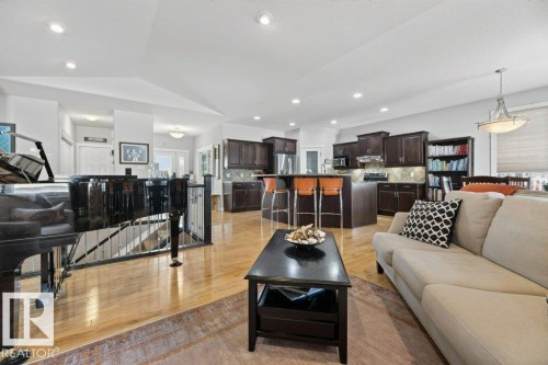 Spacious open-concept interior featuring light wood-finish flooring - 5528 43 Street, Lamont, AB 