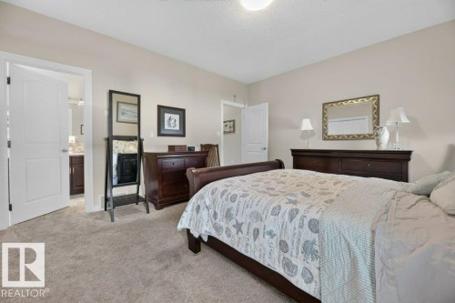Carpeted bedroom with a neutral wall palette - 5528 43 Street, Lamont, AB 