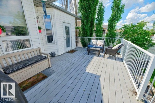 Expansive outdoor deck featuring composite decking and white picket railing - 5528 43 Street, Lamont, AB 