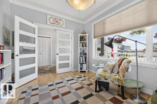Bright room with light gray walls and wood-finish flooring - 5528 43 Street, Lamont, AB 
