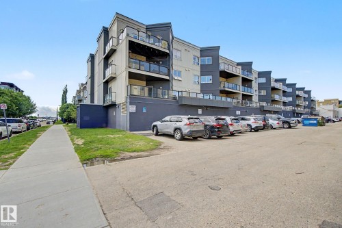 Multi-story residential building featuring a modern facade with light and dark gray siding - 413 10116 80 Avenue, Edmonton, AB 