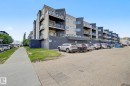 Multi-story residential building featuring a modern facade with light and dark gray siding - 413 10116 80 Avenue, Edmonton, AB 