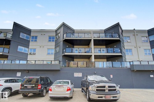 Multi-story building featuring modern grey and light-colored siding - 413 10116 80 Avenue, Edmonton, AB 