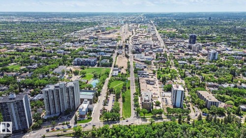 Expansive aerial perspective showcasing a vibrant urban landscape with diverse architectural structures - 413 10116 80 Avenue, Edmonton, AB 