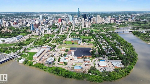 Aerial cityscape featuring a prominent river, dense urban core, and surrounding green spaces - 413 10116 80 Avenue, Edmonton, AB 