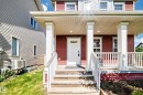 Inviting front porch with white railings and columns - 875 Chappelle Link Link, Edmonton, AB 
