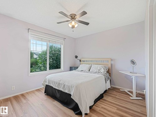 Recessed lighting and ceiling fan fixture above wood-finish flooring - 62 3075 Trelle Crescent Nw, Edmonton, AB - Indoor Photo Showing Bedroom
