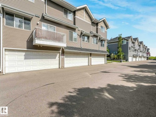 Townhome exterior featuring horizontal siding and shaker-style gables - 62 3075 Trelle Crescent Nw, Edmonton, AB - Outdoor