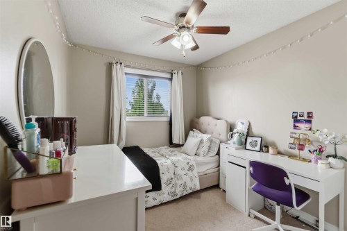 Room featuring neutral-toned walls and carpet flooring - 4428 11A Avenue, Edmonton, AB 