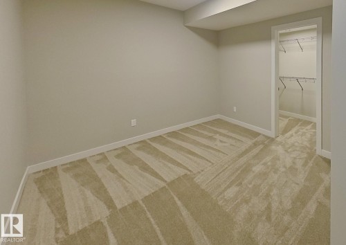 Neutral-toned carpeting throughout - #Basement 10923 159 St Nw, Edmonton, AB - Indoor Photo Showing Other Room