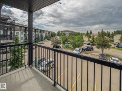 Private balcony featuring a concrete floor and black metal railing - 