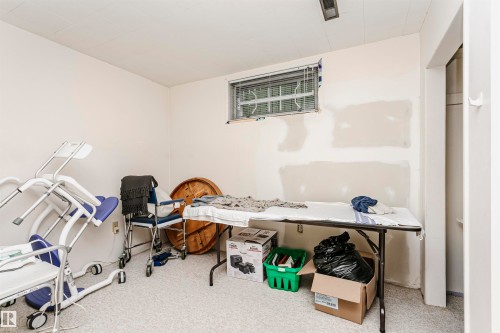 Room featuring light-colored walls, a window with horizontal blinds, and a white ceiling - 14231 80 Street, Edmonton, AB 