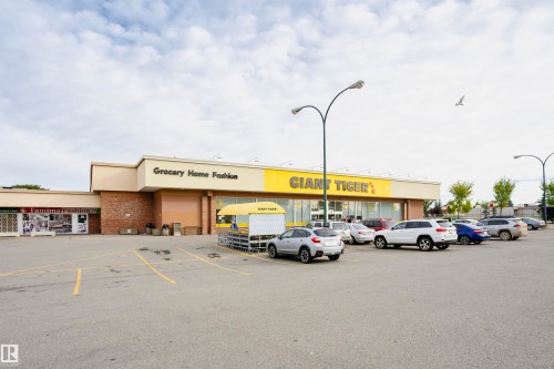 Retail building featuring a brick facade and prominent signage - 14231 80 Street, Edmonton, AB 