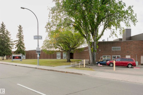 Brick-clad building with multiple windows - 14231 80 Street, Edmonton, AB 