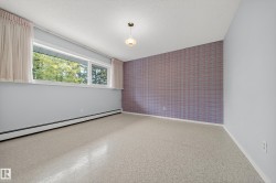 Bright interior space with patterned flooring and a large horizontal window - 