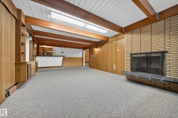 Recessed fireplace with a black metal screen and hearth - 