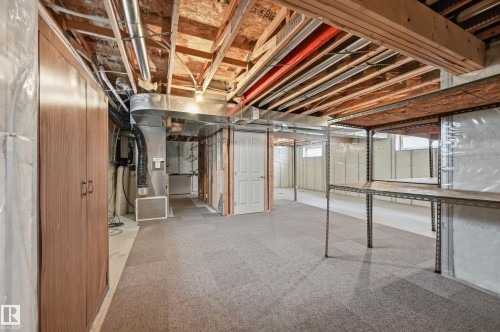 Lower level featuring carpeted flooring and exposed ceiling joists - 7460 Singer Landing, Edmonton, AB 