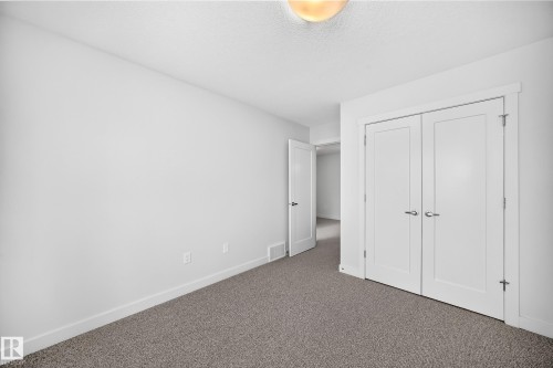 Room with neutral-toned carpet flooring and white walls - 2433 Glenridding Boulevard, Edmonton, AB 