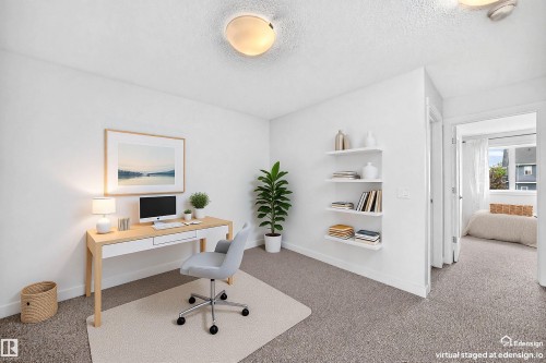 Flexible room featuring neutral-toned carpeting, white walls, and built-in floating shelves - 2433 Glenridding Boulevard, Edmonton, AB 